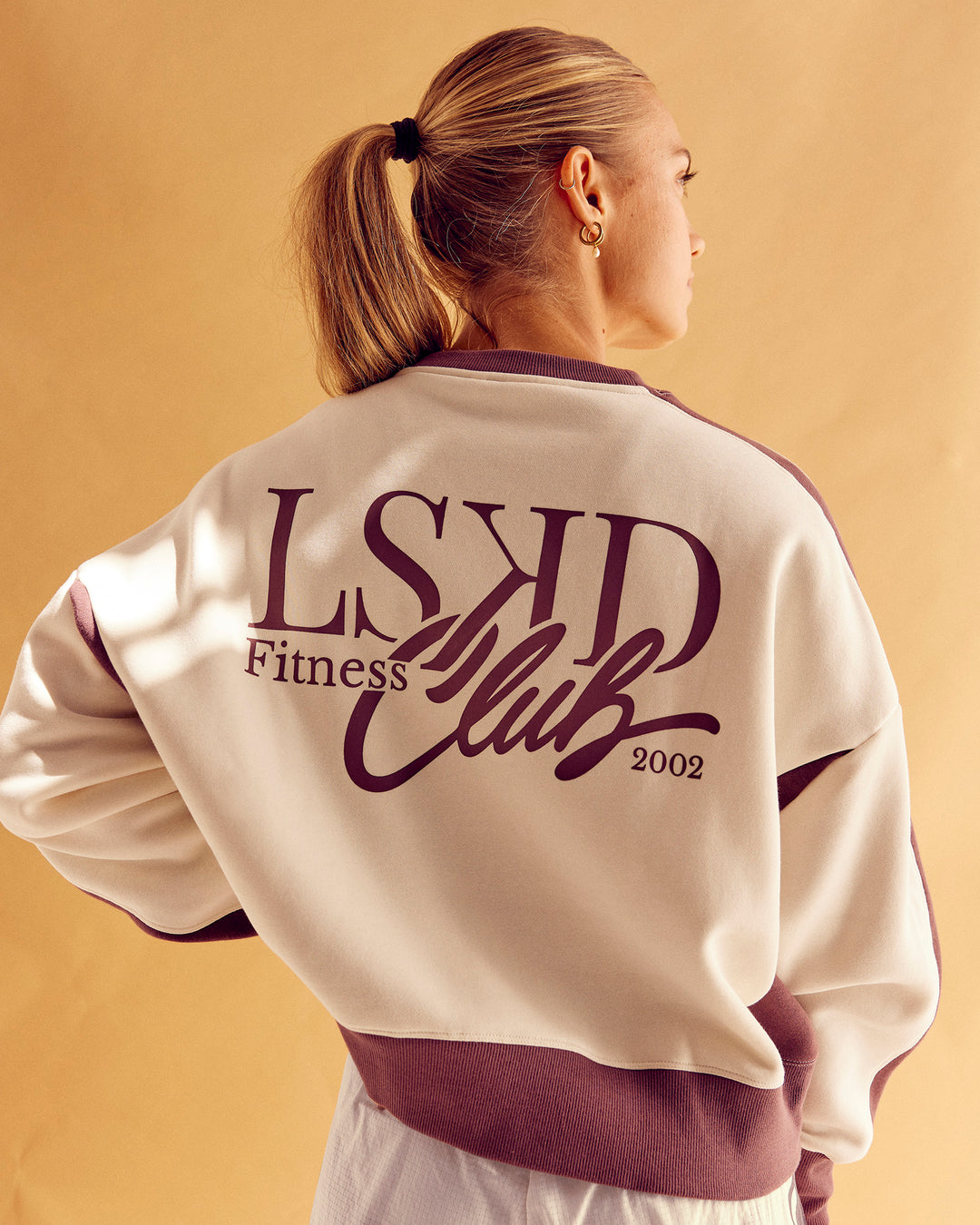 Woman wearing LSKD Fitness Club Oversized Sweater - Off White-Cocoa Powder | Model:Maja | Size:XS