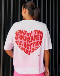 Woman wearing Love the Journey FLXCotton Oversized Tee - White-Candy Pink | Model:Shae | Size:XS