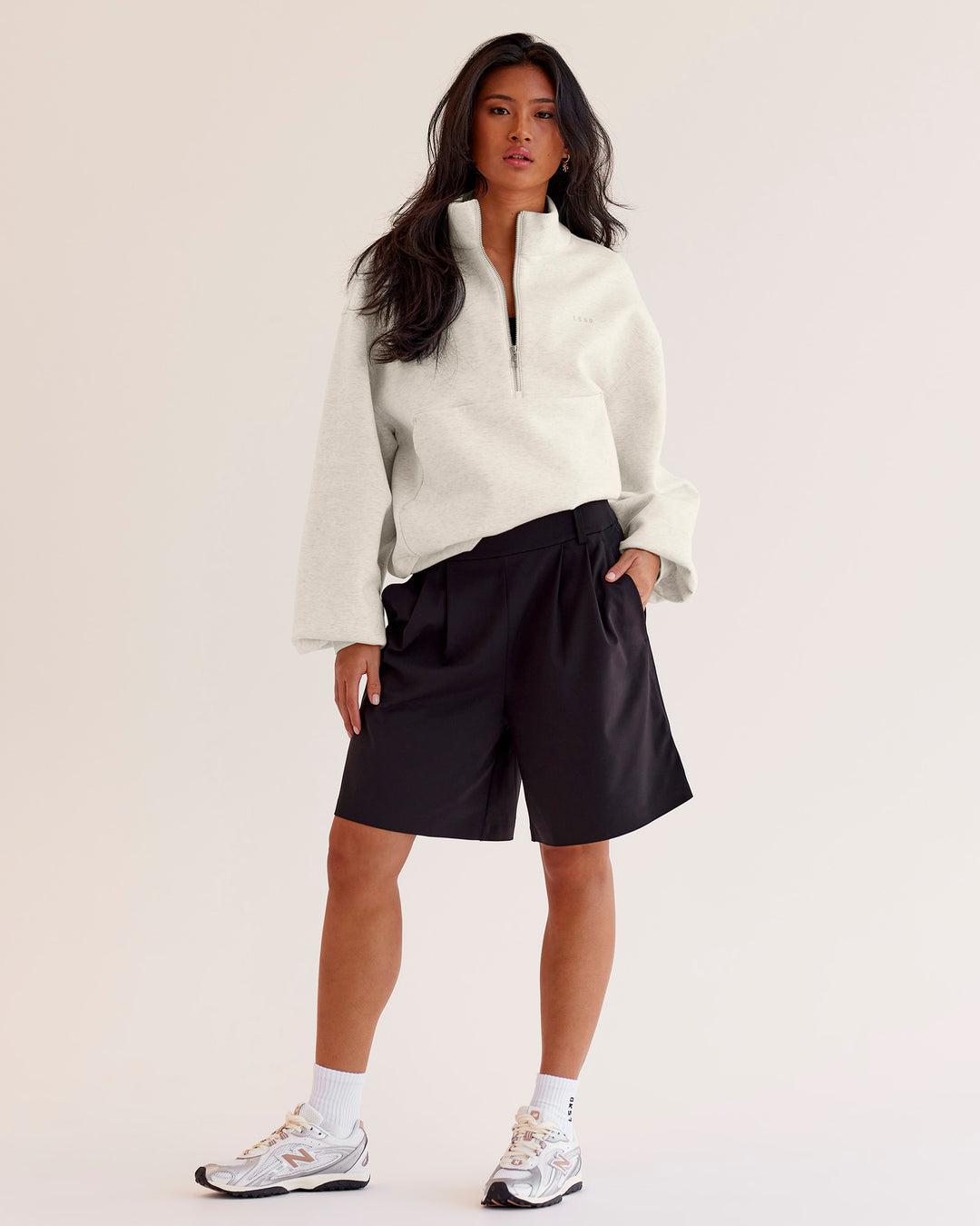 Woman wearing Luxe ZeroCrease Spacer Half Zip - Silver Marl | Model:Loren | Size:XS