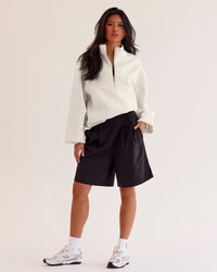 Woman wearing Luxe ZeroCrease Spacer Half Zip - Silver Marl | Model:Loren | Size:XS