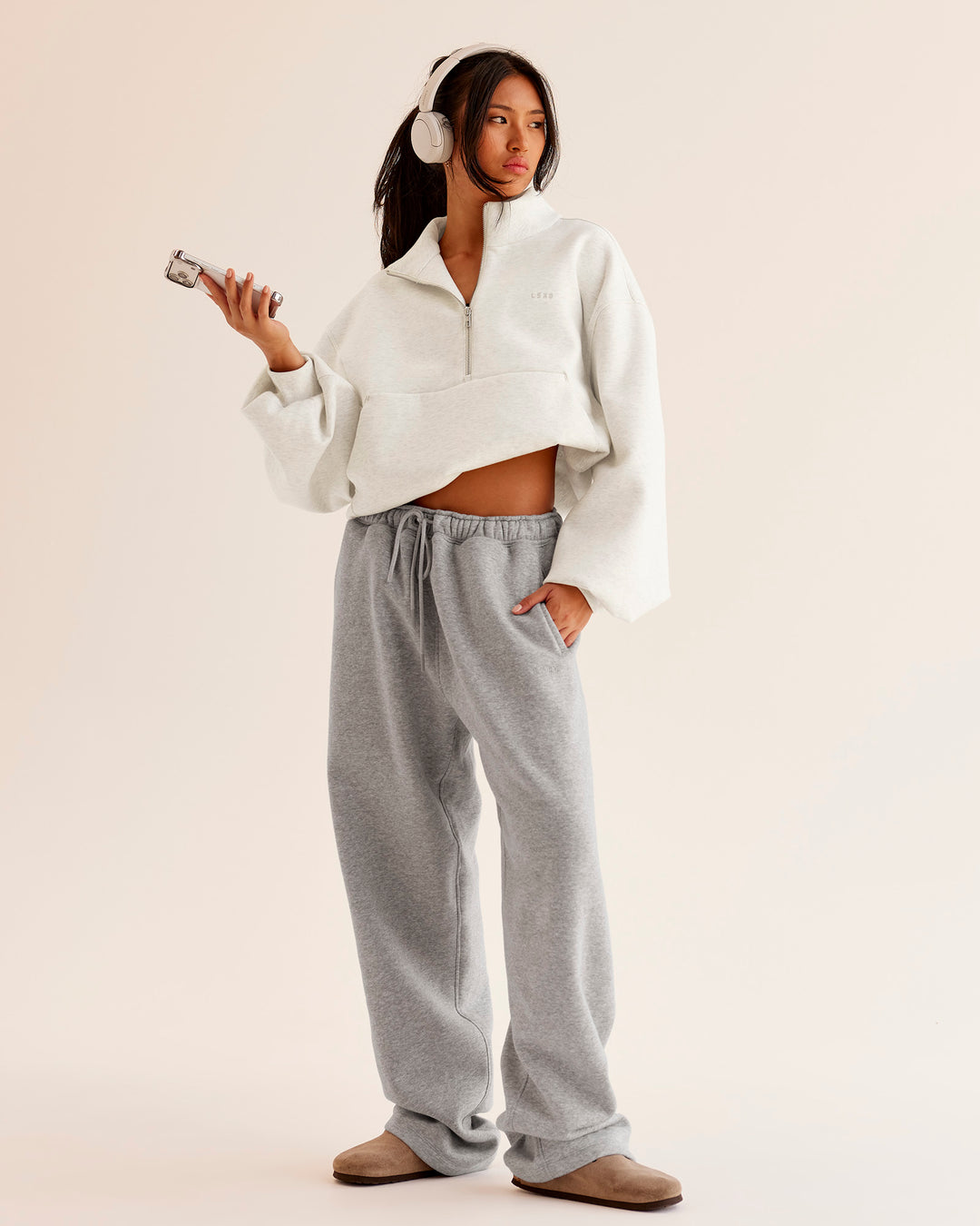 Woman wearing Luxe ZeroCrease Spacer Half Zip - Silver Marl | Model:Loren | Size:XS