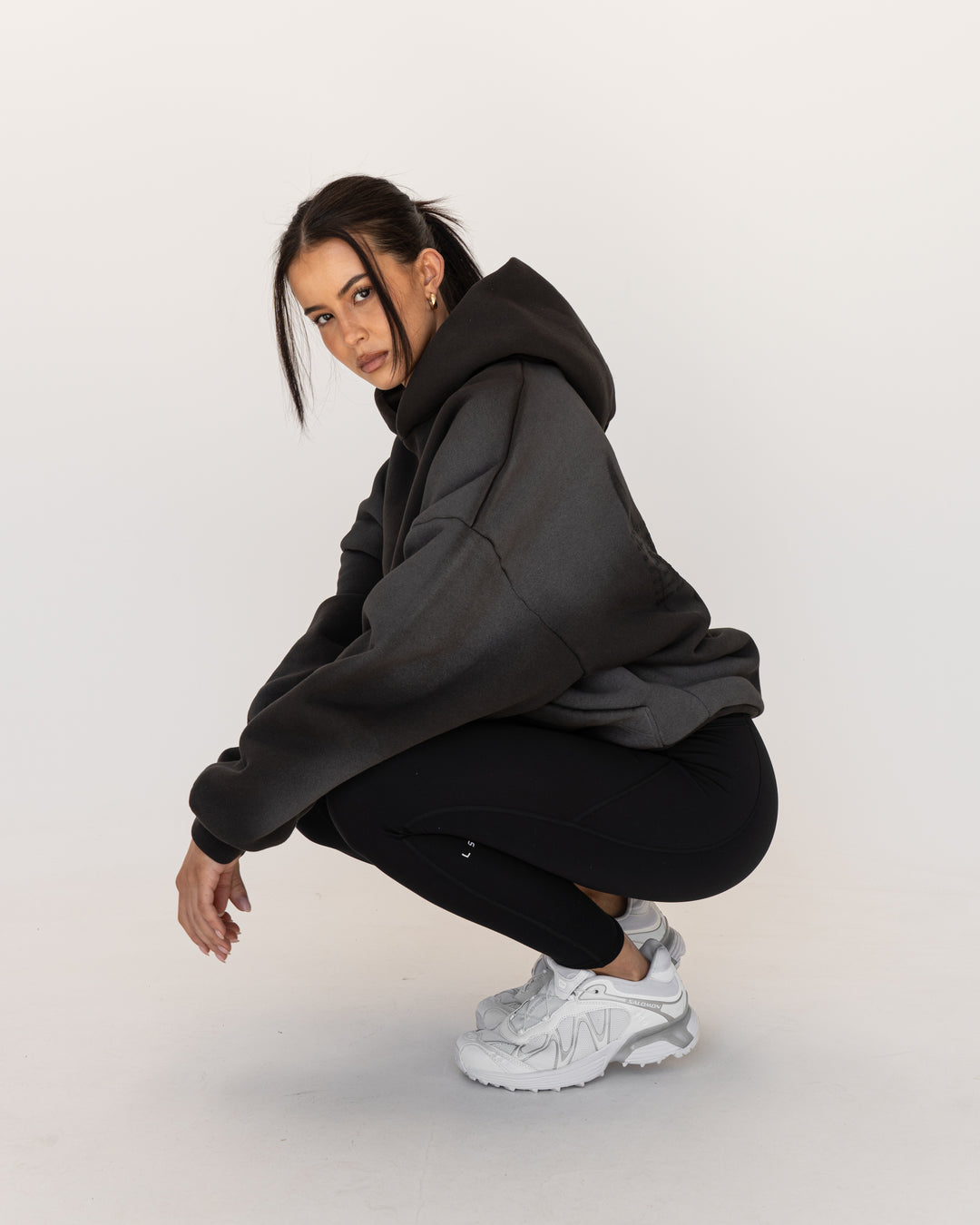 Woman wearing Memory In Motion 500gsm Ultra Heavyweight Washed Hoodie - Charcoal Washed | Model:Eliza | Size:XS