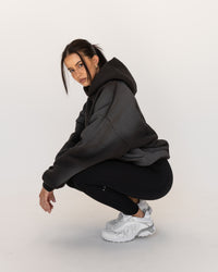 Woman wearing Memory In Motion 500gsm Ultra Heavyweight Washed Hoodie - Charcoal Washed | Model:Eliza | Size:XS