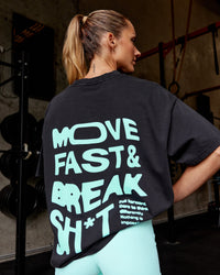 Woman wearing Move Fast Washed Heavyweight Tee Oversize - Black-Island Paradise | Model:Lauren | Size:XS