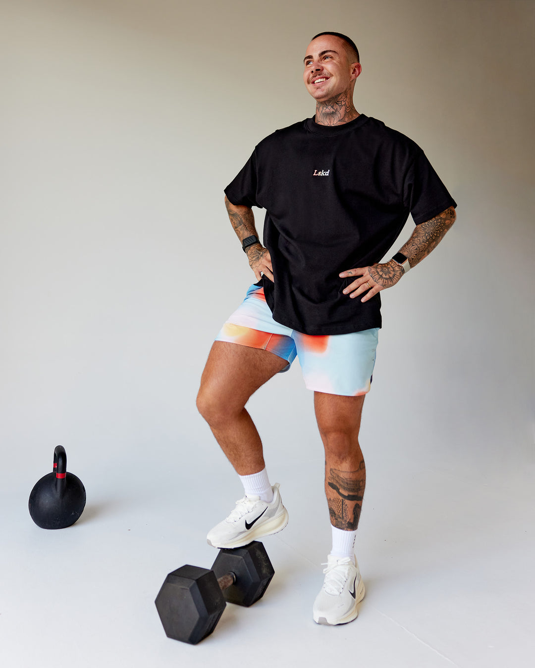 Man wearing Our Journey Heavyweight Oversized Tee - Black-Rainbow | Model:Tayden | Size:XS