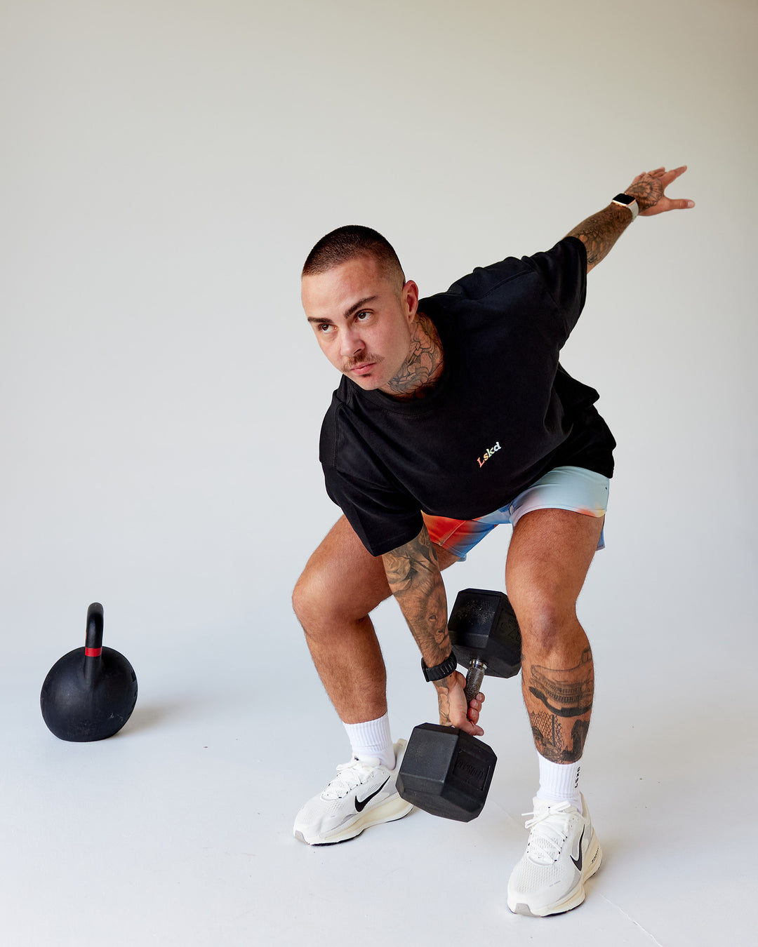 Man wearing Our Journey Heavyweight Oversized Tee - Black-Rainbow | Model:Tayden | Size:XS