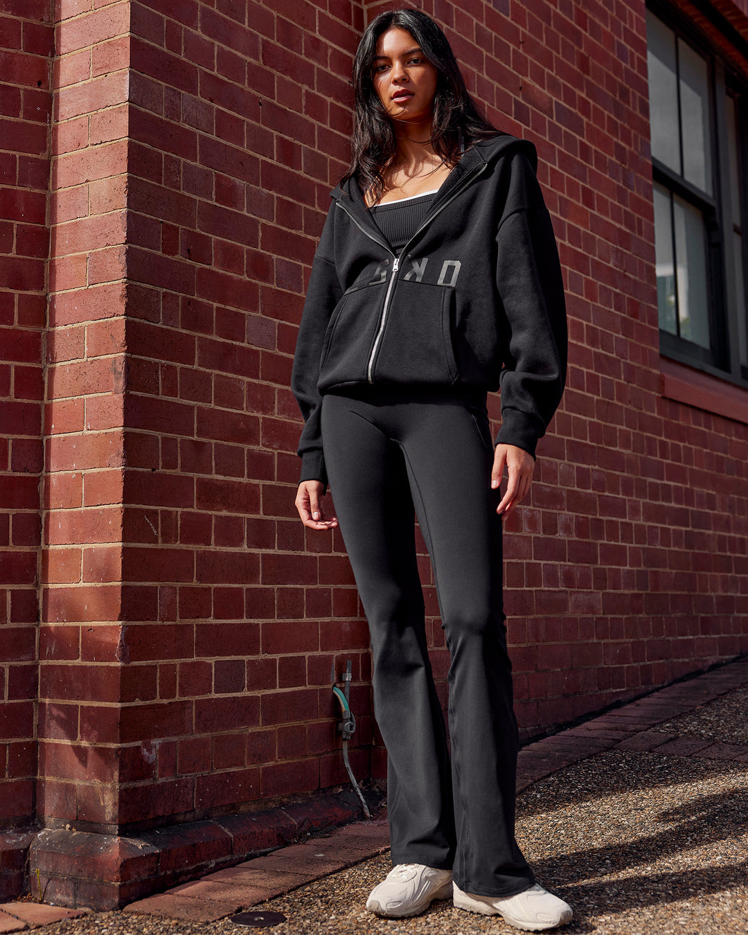 Woman wearing Shadow Mode Oversized Zip Through Hoodie - Black | Model:Alex | Size:XS