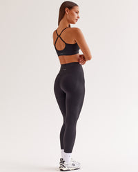 Woman wearing Surge Seamless High-Rise Full Length Legging - Black | Model:Brylee | Size:XS