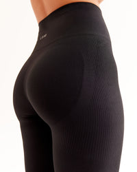 Woman wearing Surge Seamless High-Rise Full Length Legging - Black | Model:Brylee | Size:XS