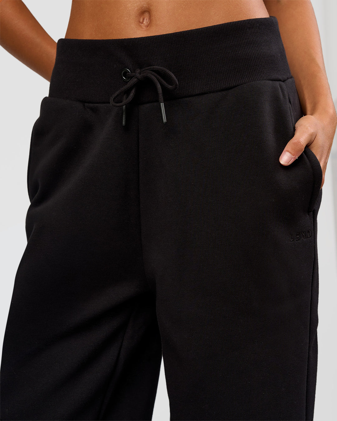 Woman wearing Go-To Wide Leg Track Pant Tall - Black | Model:Georgia | Size:XS