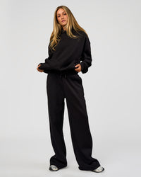 Woman wearing Go-To Wide Leg Track Pant Tall - Black | Model:Georgia | Size:XS