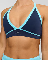 Woman wearing Breeze Sports Bra - Future Navy-Baltic Sea | Model:Grace | Size:XS