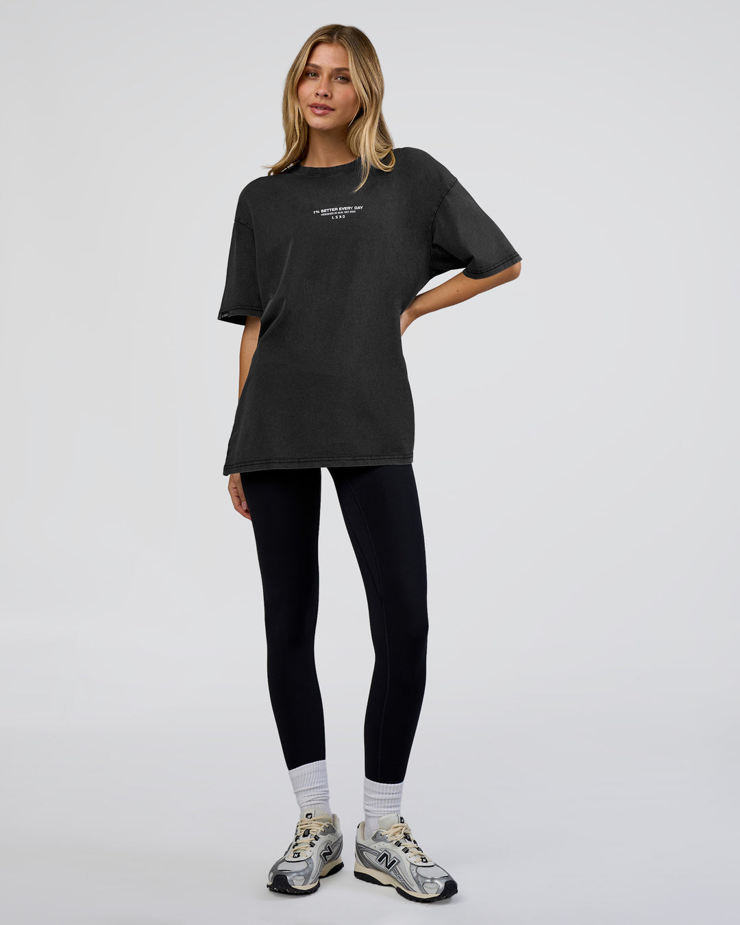 Woman wearing 1% Better Every Day EST FLXCotton Oversized Tee - Black Washed | Model:Leilani | Size:XS