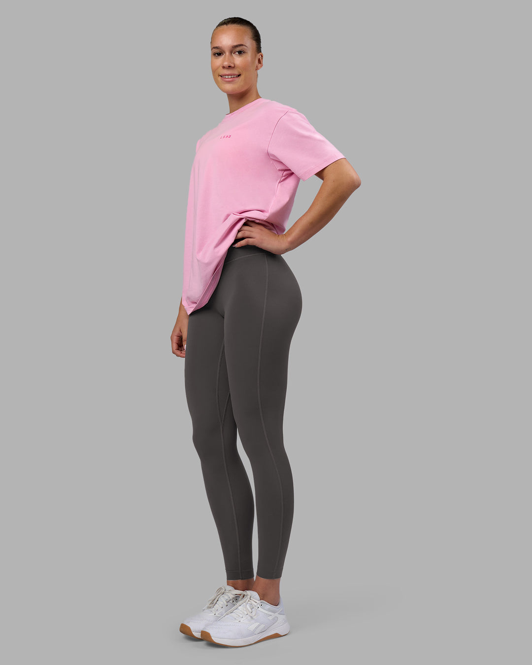Woman wearing 1% Better Value Series FLXCotton Tee Oversize - Bubblegum-Ultra Pink | Model:Charlize | Size:XS