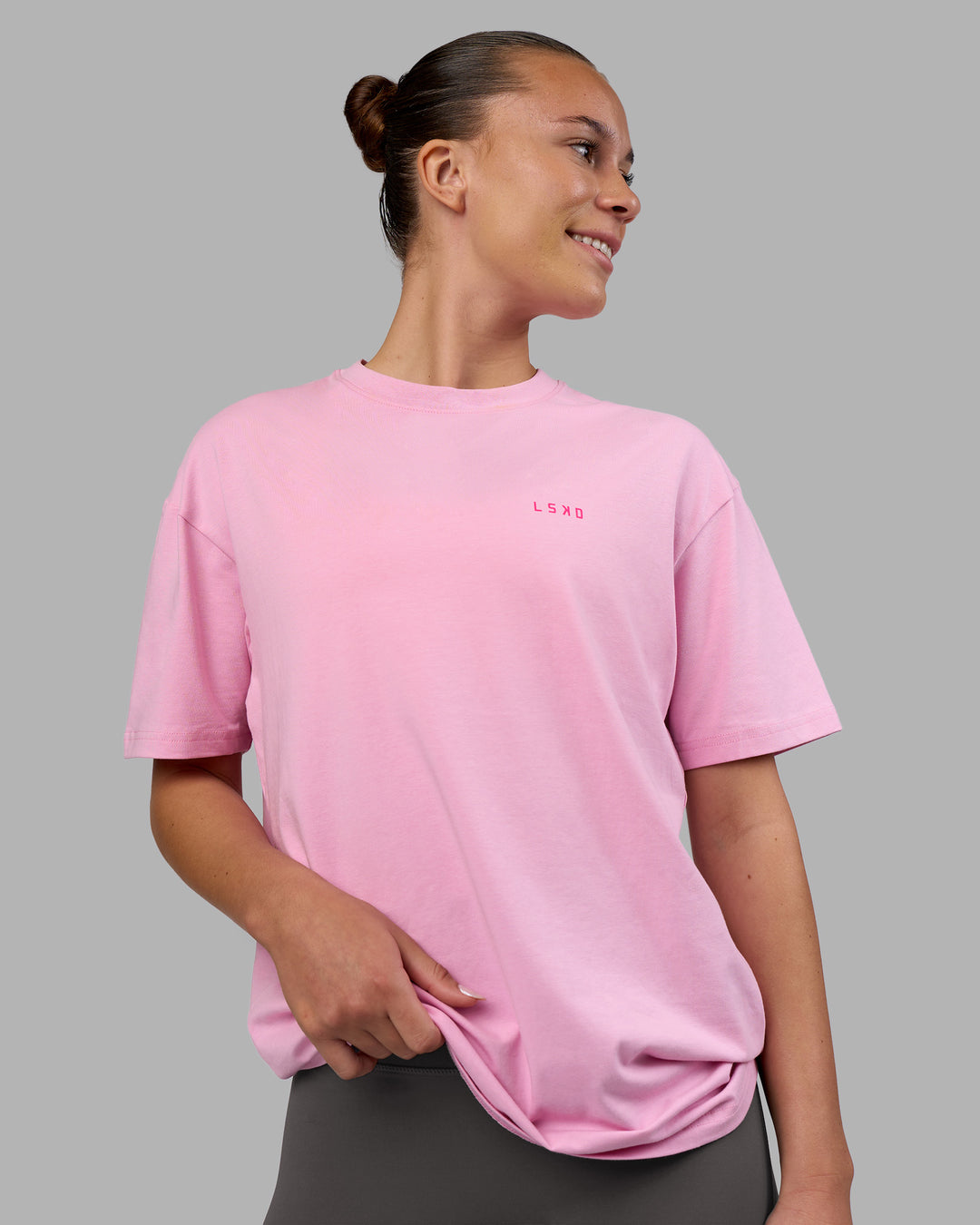 Woman wearing 1% Better Value Series FLXCotton Tee Oversize - Bubblegum-Ultra Pink | Model:Charlize | Size:XS