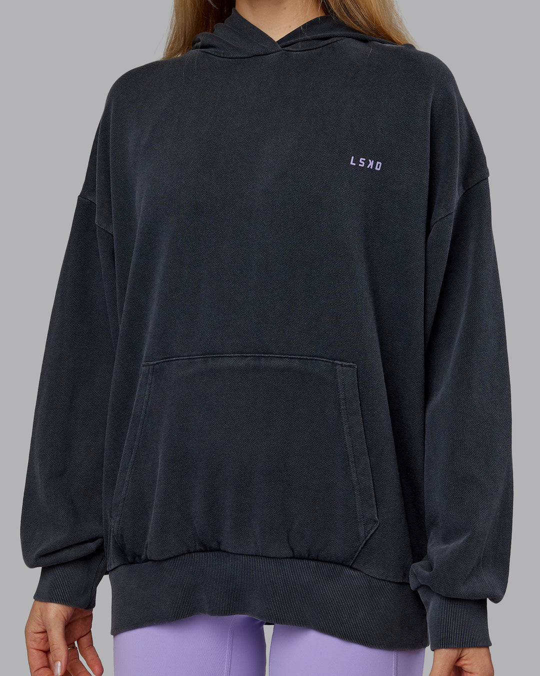 Woman wearing 1% Better Value Series Oversized Hoodie - Black-Violet Ray | Model:Emilie | Size:XS