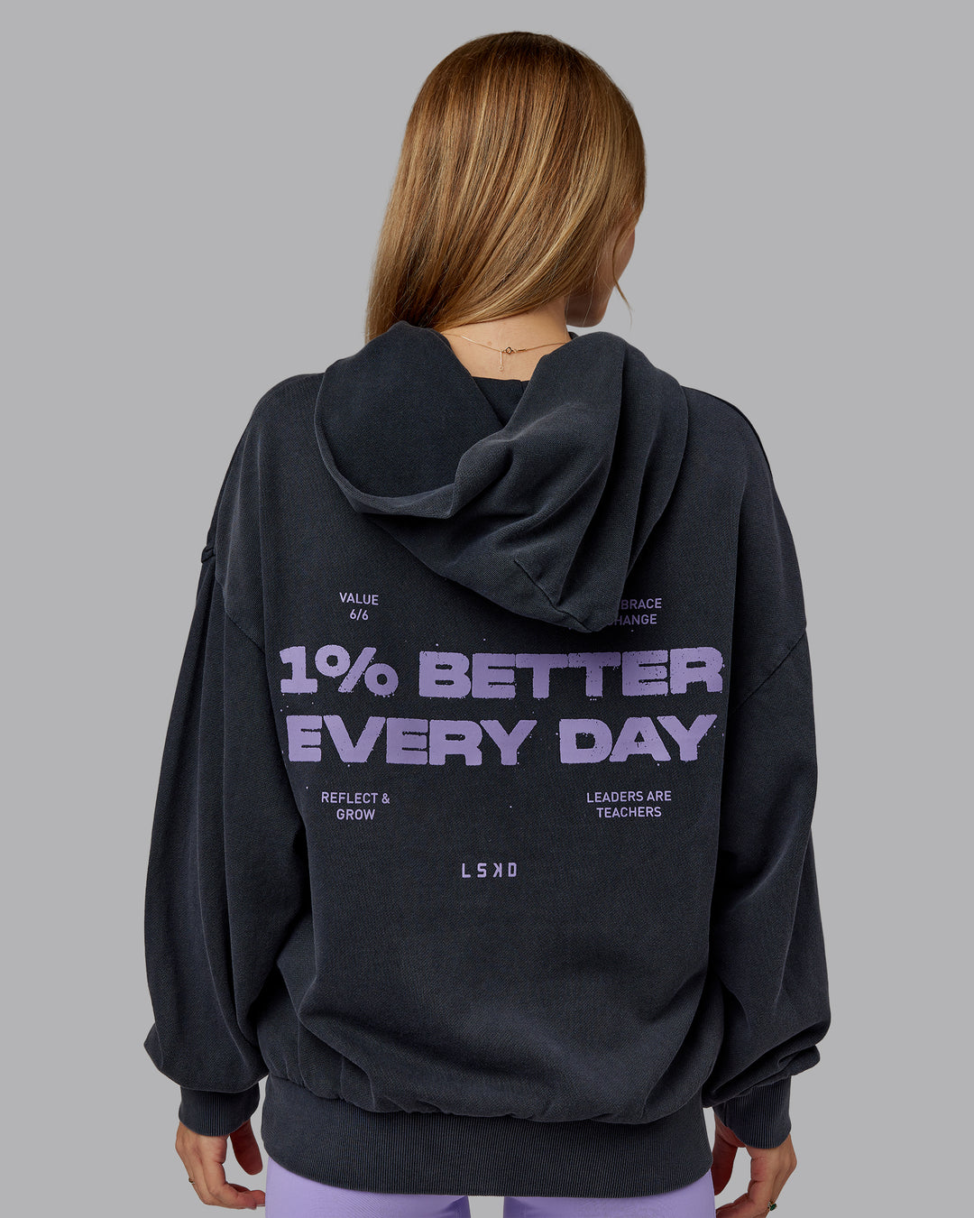 Woman wearing 1% Better Value Series Oversized Hoodie - Black-Violet Ray | Model:Emilie | Size:XS