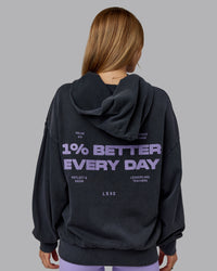 Woman wearing 1% Better Value Series Oversized Hoodie - Black-Violet Ray | Model:Emilie | Size:XS