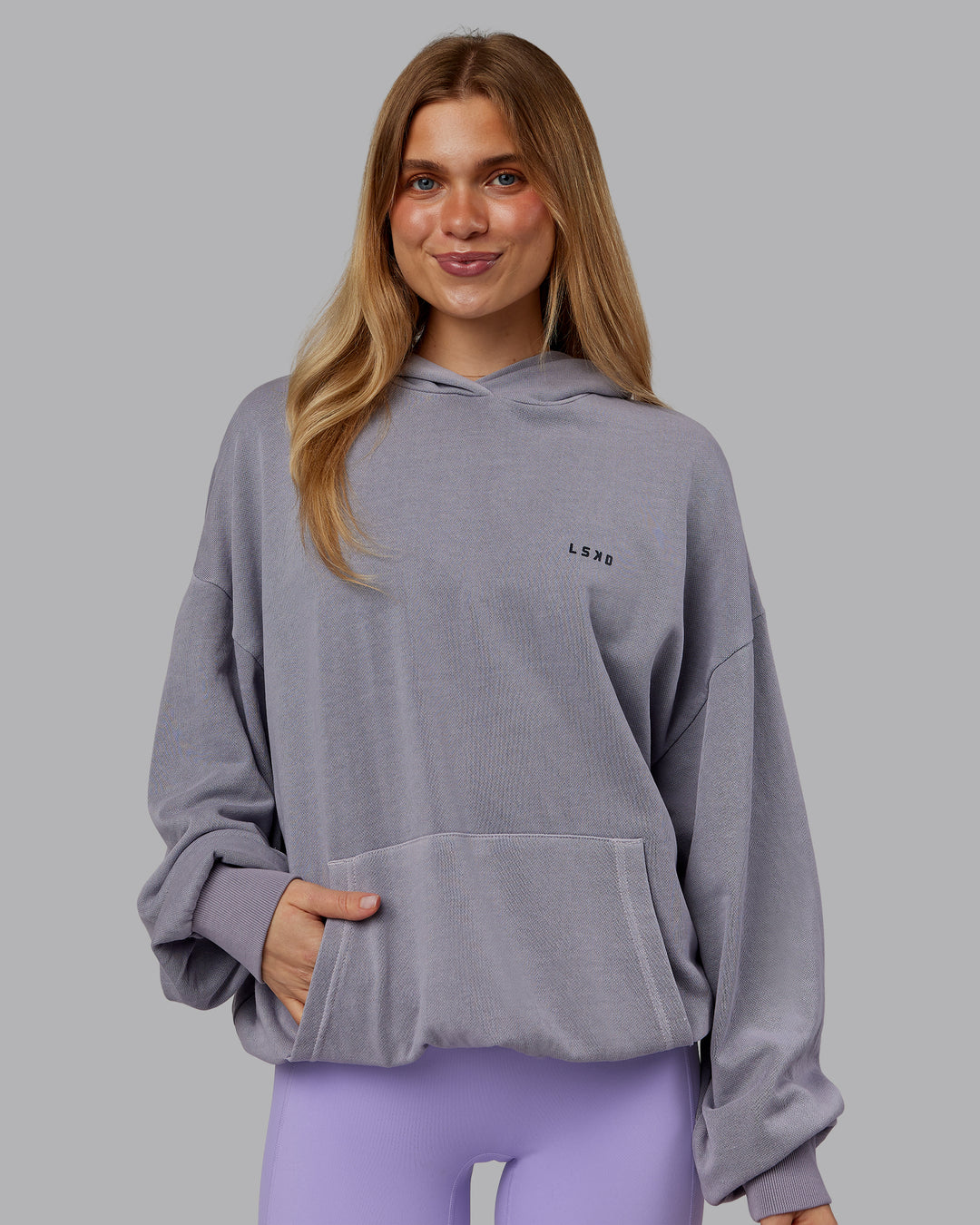 Woman wearing 1% Better Value Series Oversized Hoodie - Violet Ray-Black | Model:Emilie | Size:XS