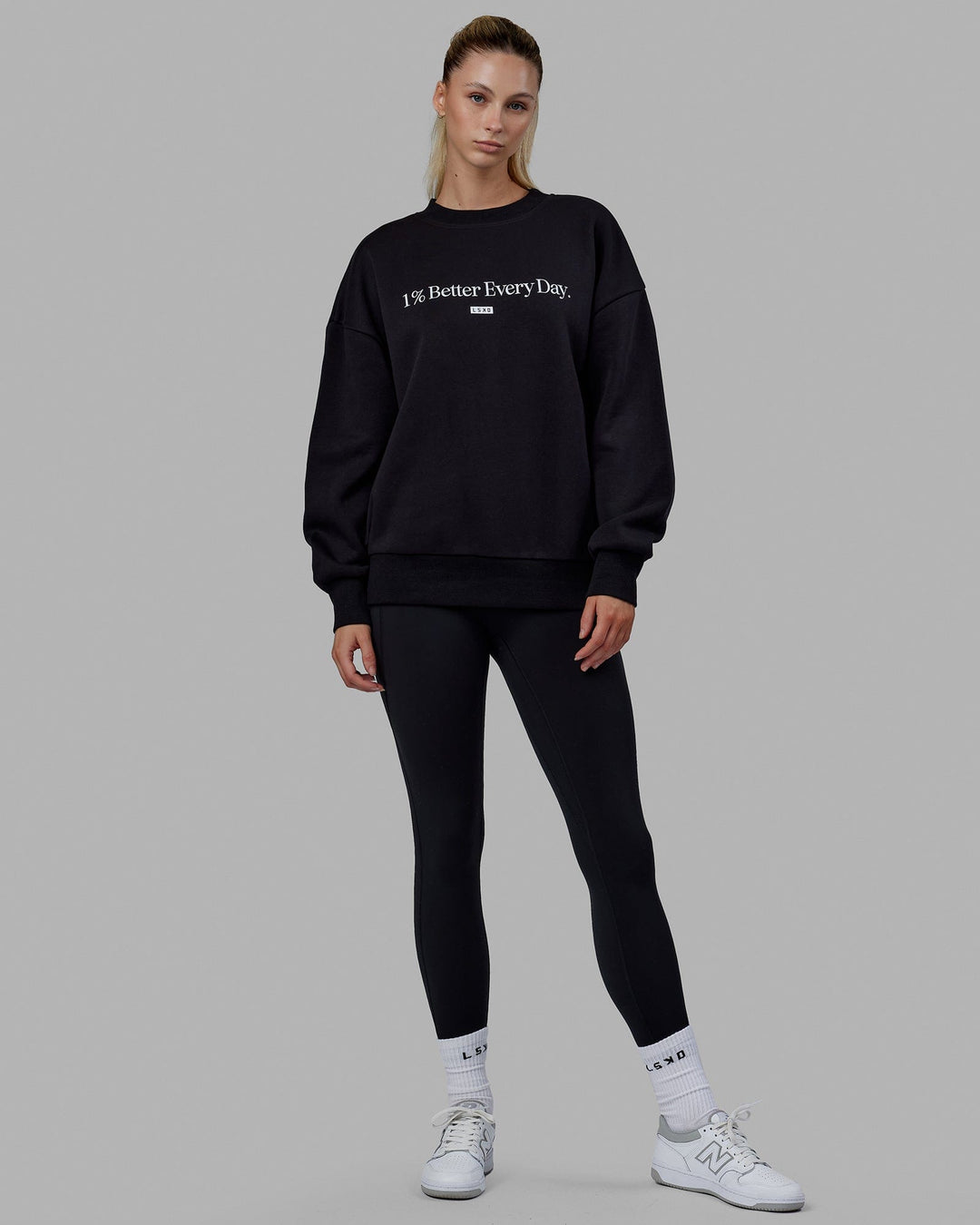 Woman wearing Unisex 1% Better Sweater Oversize - Black-White