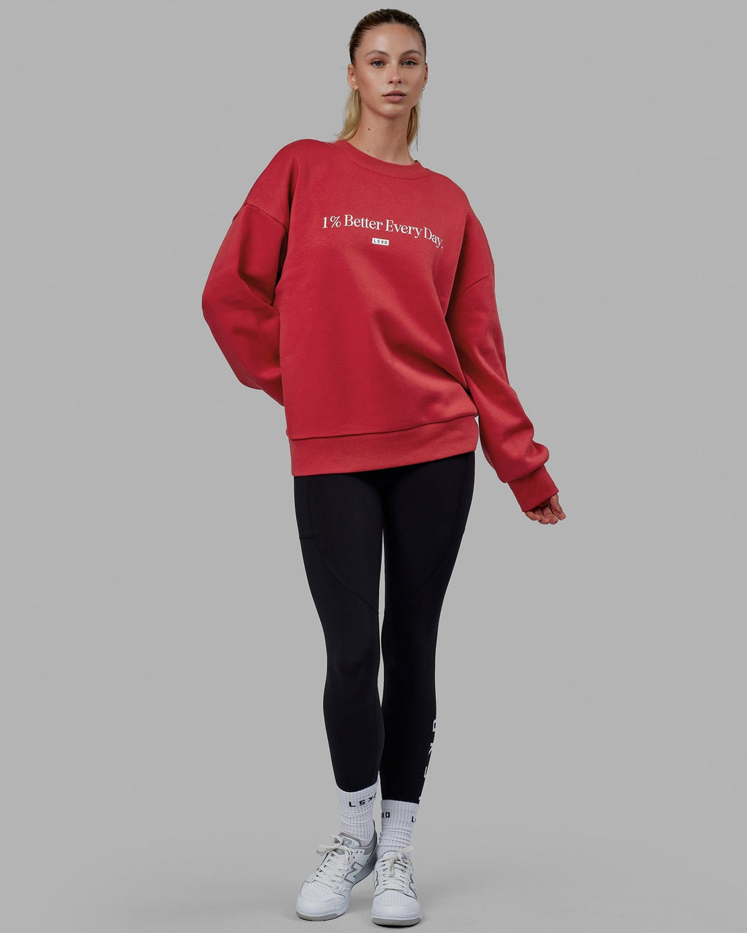 Woman wearing Unisex 1% Better Sweater Oversize - Cardinal