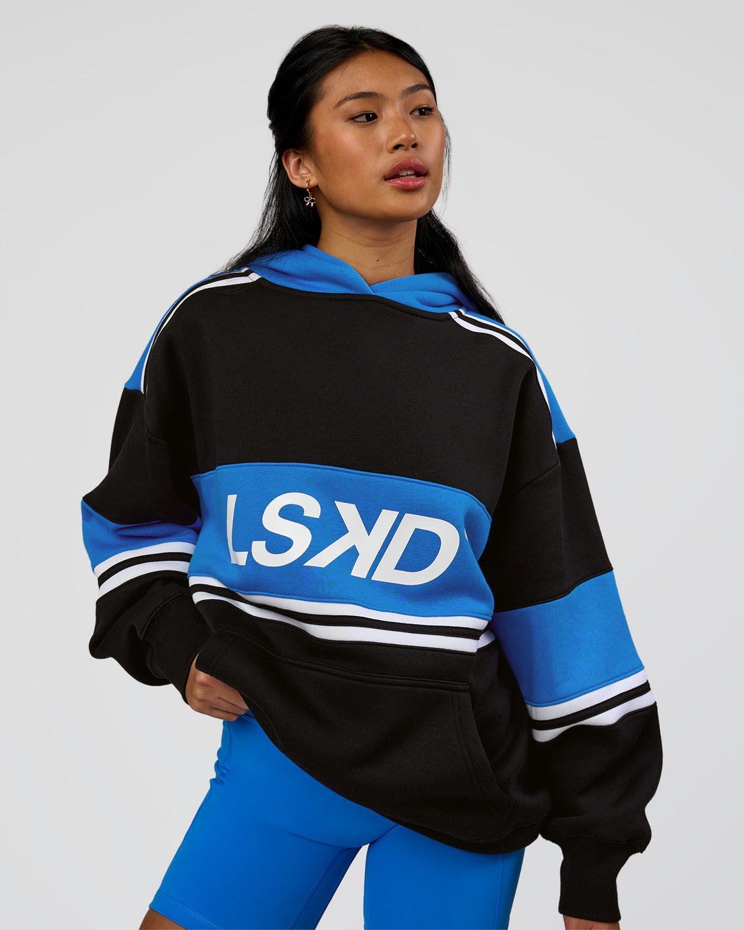 Woman wearing A-Team Oversized Hoodie - Caviar-Palace Blue | Model:Loren | Size:XS