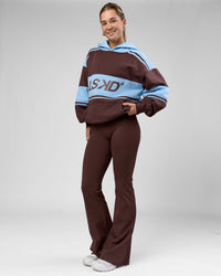 Woman wearing A-Team Oversized Hoodie - Hot Chocolate-Open Air | Model:Amity | Size:XS