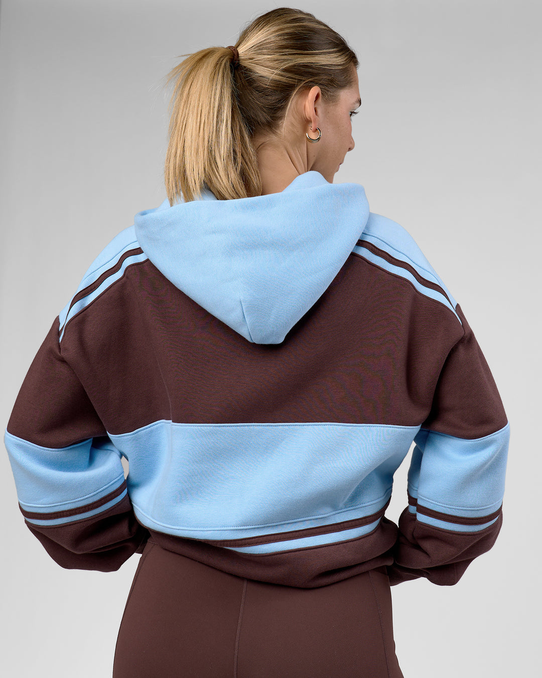 Woman wearing A-Team Oversized Hoodie - Hot Chocolate-Open Air | Model:Amity | Size:XS