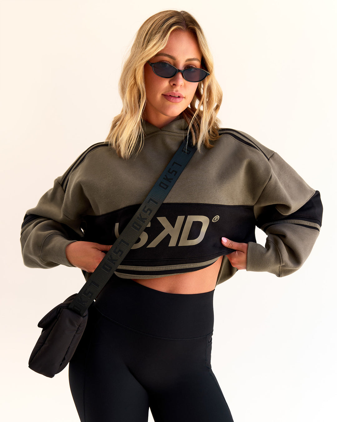 Woman wearing A-Team Oversized Hoodie - Walnut Grey-Caviar | Model:Taylah | Size:XS