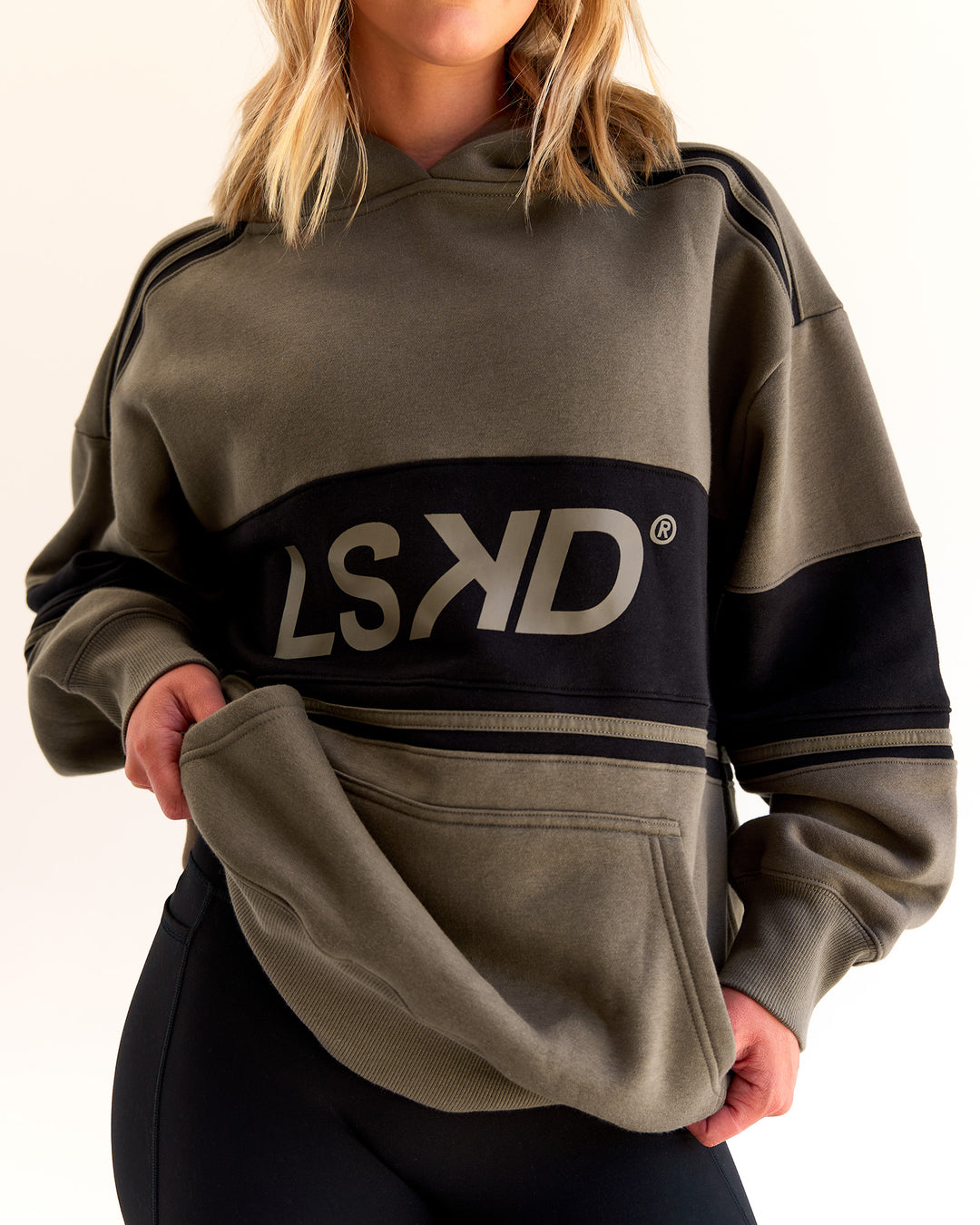 Woman wearing A-Team Oversized Hoodie - Walnut Grey-Caviar | Model:Taylah | Size:XS
