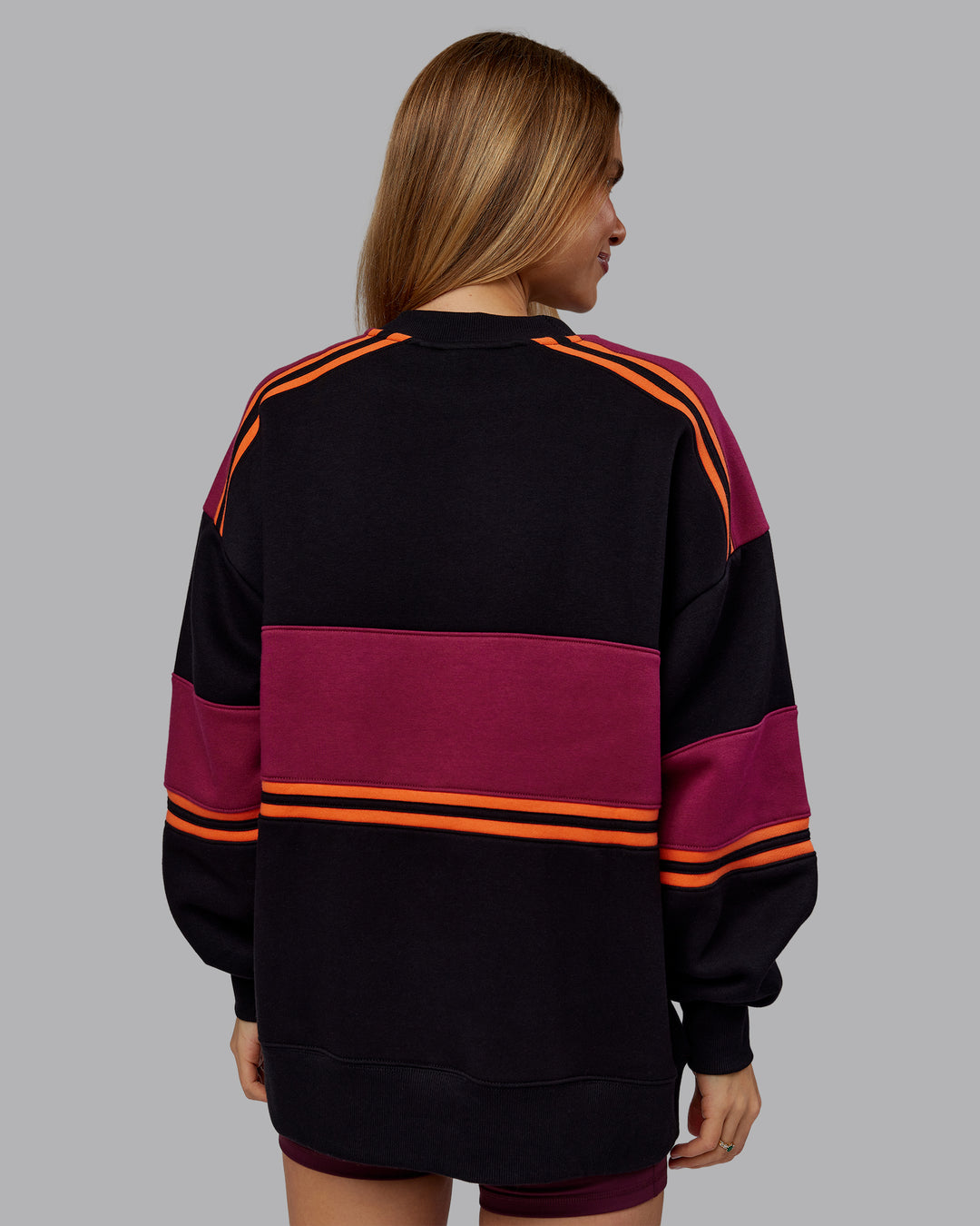 Woman wearing A-Team Sweater Oversize - Black-Plum Berry | Model:Emilie | Size:XS