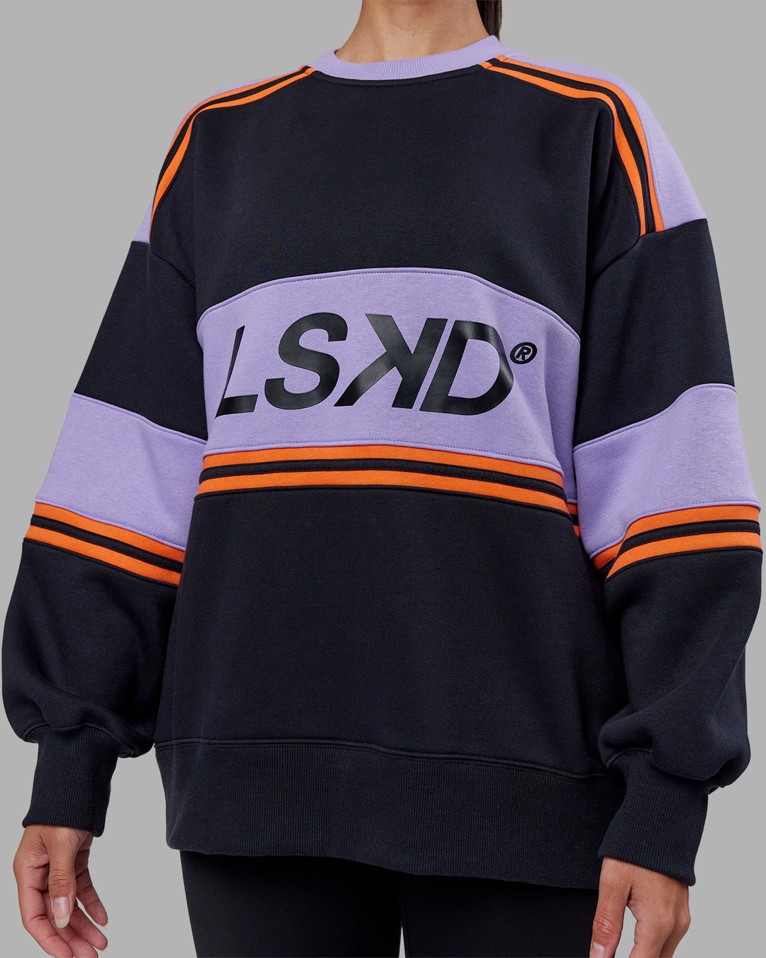 Woman wearing A-Team Sweater Oversize - Caviar-Violet Ray | Model:Rhiley | Size:XS