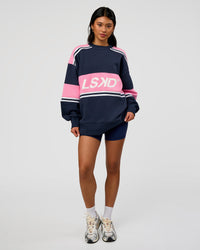 Woman wearing A-Team Sweater Oversize - Future Navy-Candy Pink | Model:Loren | Size:XS