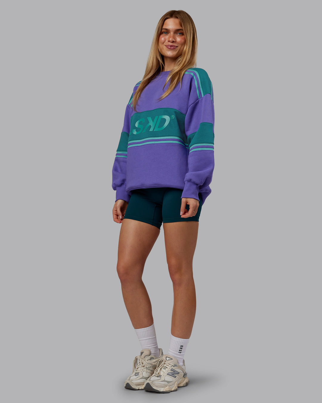 Woman wearing A-Team Sweater Oversize - Royal Purple-Multi | Model:Emilie | Size:XS