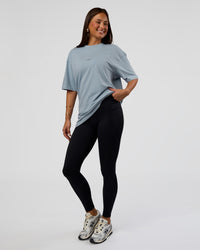 Woman wearing Abstract Haze FLXCotton Tee - Dusty Blue-Black | Model:Bianca | Size:XS