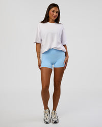 Woman wearing Abstract Haze FLXCotton Tee - White-Blue Aura | Model:Bianca | Size:XS