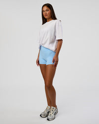 Woman wearing Abstract Haze FLXCotton Tee - White-Blue Aura | Model:Bianca | Size:XS