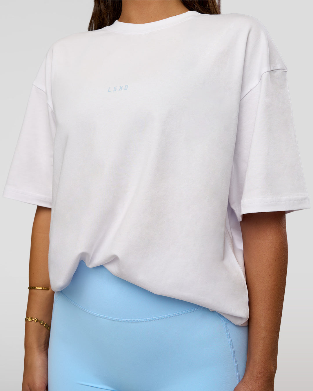 Woman wearing Abstract Haze FLXCotton Tee - White-Blue Aura | Model:Bianca | Size:XS