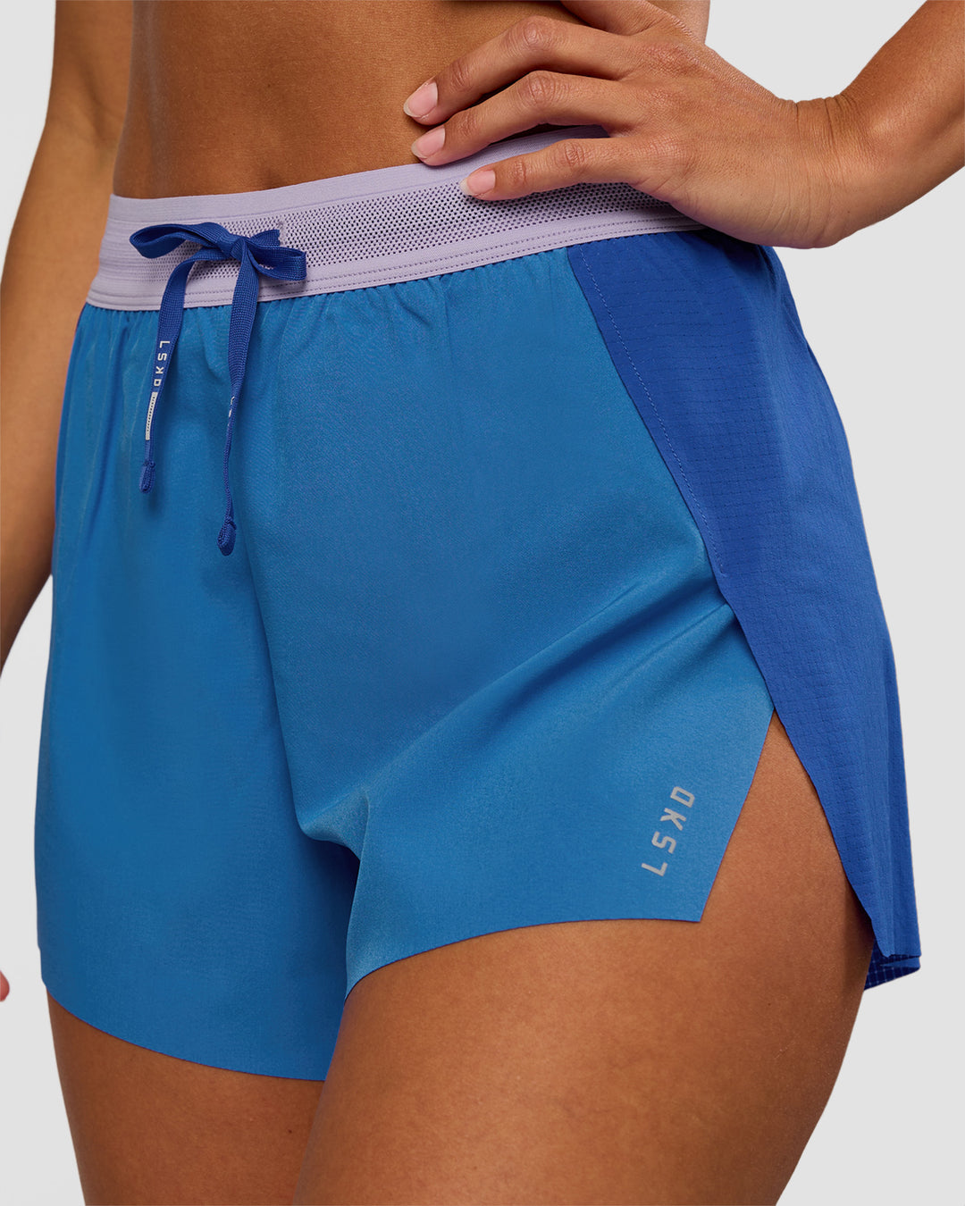 Woman wearing Accelerate 3" High-Rise Running Short - Electric Indigo-Multi | Set:true | Angle:closeup | Model:Brylee | Size:XS
