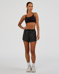 Woman wearing Accelerate 3" High-Rise Running Short - Energy Print Black | Model:Brylee | Size:XS