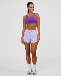 Woman wearing Accelerate 3" High-Rise Running Short - Pale Lilac | Model:Brylee | Size:XS