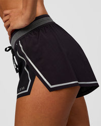 Woman wearing Accelerate 3" Reflective Mid-Rise Running Short - Black-Reflective | Model:Brylee | Size:XS