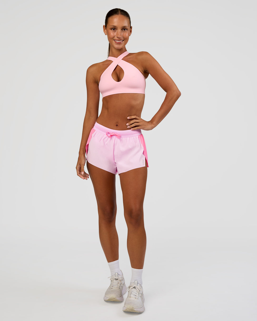 Woman wearing Accelerate 3" Mid-Rise Running Short - Candy Pink-Marshmallow | Model:Brylee | Size:XS