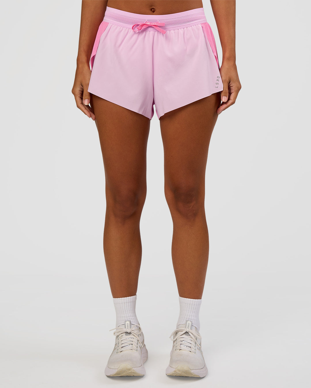 Woman wearing Accelerate 3" Mid-Rise Running Short - Candy Pink-Marshmallow | Model:Brylee | Size:XS