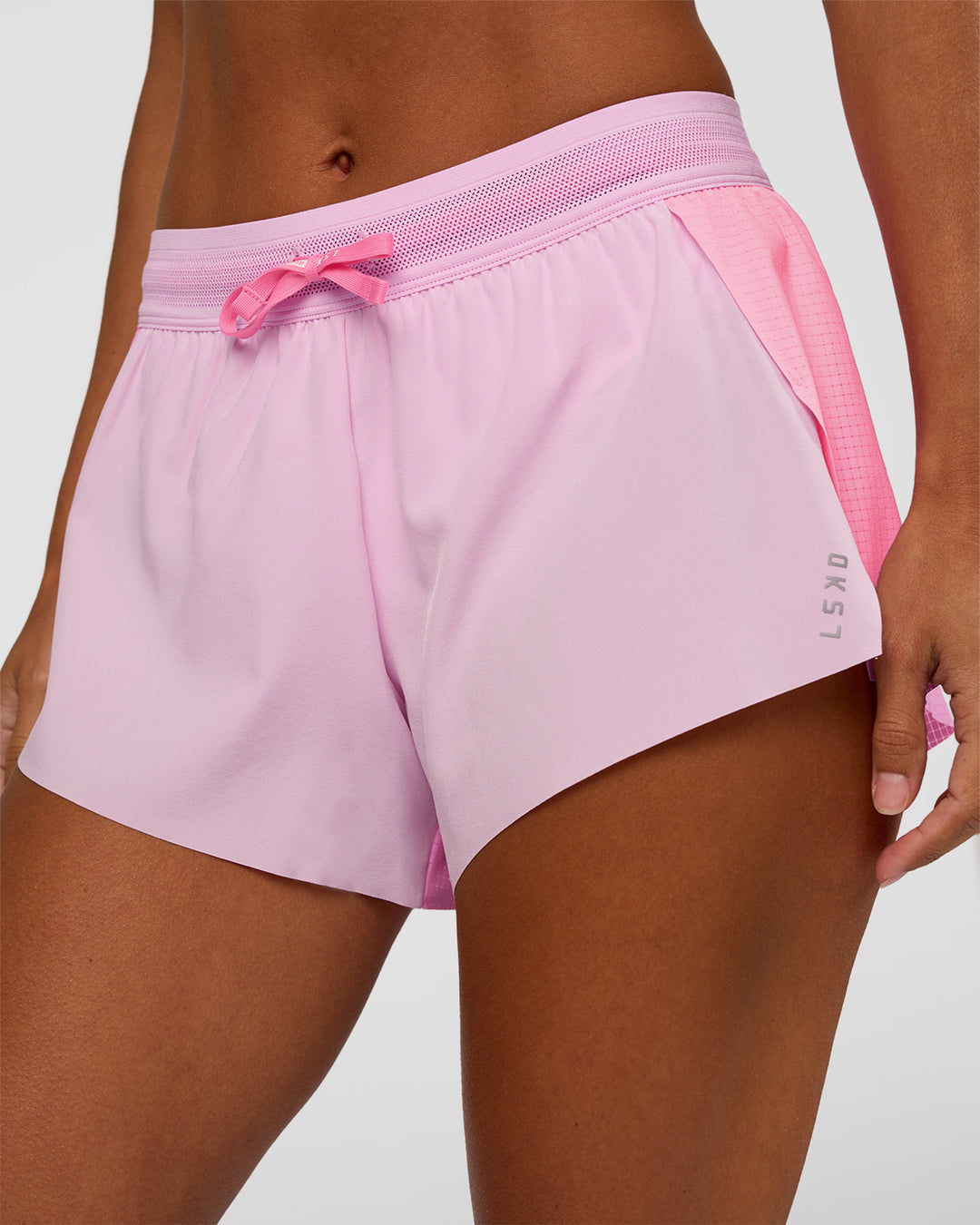 Woman wearing Accelerate 3" Mid-Rise Running Short - Candy Pink-Marshmallow | Model:Brylee | Size:XS