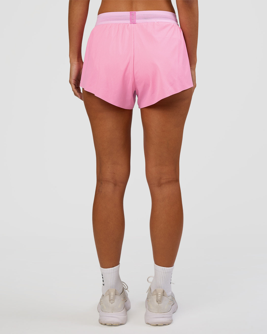 Woman wearing Accelerate 3" Mid-Rise Running Short - Candy Pink-Marshmallow | Model:Brylee | Size:XS
