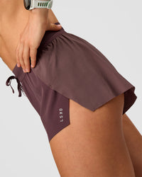 Woman wearing Accelerate 3" Mid-Rise Running Short - Cocoa Powder | Model:Maja | Size:XS
