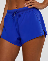 Woman wearing Accelerate 3" Mid-Rise Running Short - Electric Indigo | Set:true | Angle:closeup | Model:Brylee | Size:XS