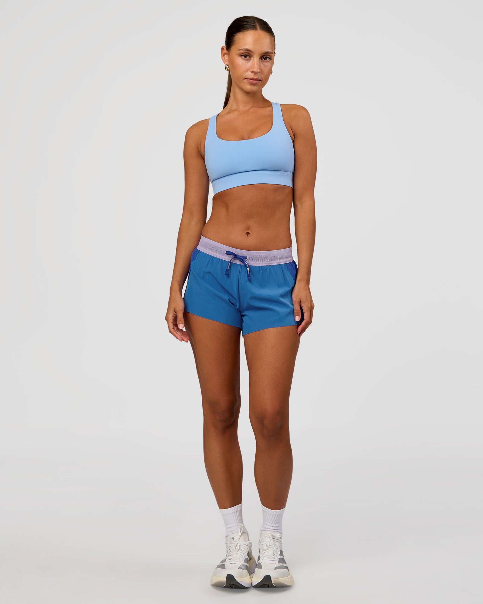 Woman wearing Accelerate 3" Mid-Rise Running Short - Electric Indigo-Multi | Model:Brylee | Size:XS