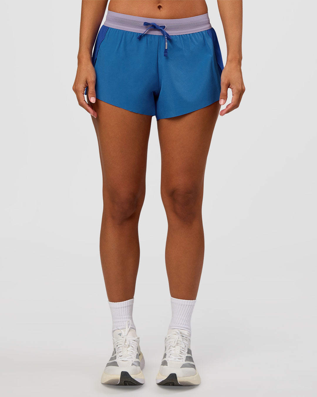 Woman wearing Accelerate 3" Mid-Rise Running Short - Electric Indigo-Multi | Set:true | Angle:front | Model:Brylee | Size:XS